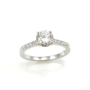 custom solitaire engagement with 4 prong set diamond center stone accented with diamonds