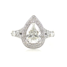 Load image into Gallery viewer,  halo engagement ring featuring a pear shaped center stone with round brilliant diamond and milgrain accents