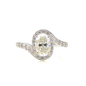custom engagement ring prong-set center stone and diamond accented bypass-style shank