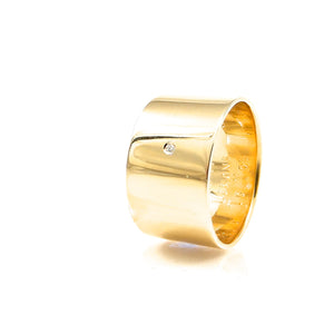wide, yellow-gold wedding ring with diamond