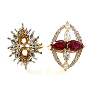 pear cut rubies and marquise diamond ring with a round brilliant cut diamond accented frame