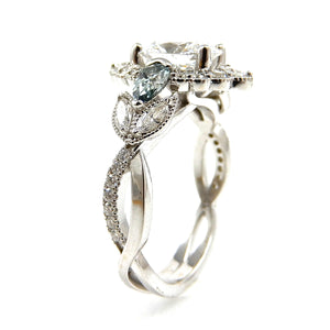 Detail view of Oval Cut Diamond with Scalloped Halo and Accented Twisted Band Engagement Ring