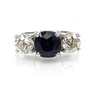 Round Sapphire and Diamond Three Stone Ring