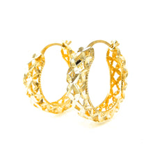 Load image into Gallery viewer, Gold hoop earrings with intricate design on a white background