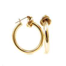Load image into Gallery viewer, Gold hoop earrings on a white background
