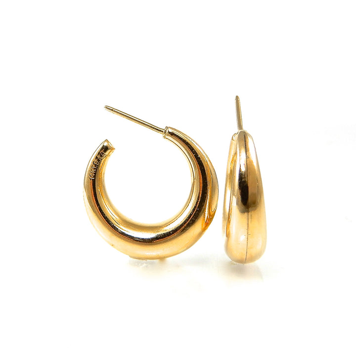 Gold hoop earrings on a white background