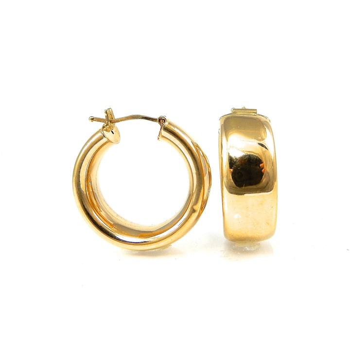 Gold hoop earrings on a white background