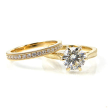 Load image into Gallery viewer, Solitaire Diamond Engagement ring and band with hidden halo and ruby detail with a milgrain detail on band