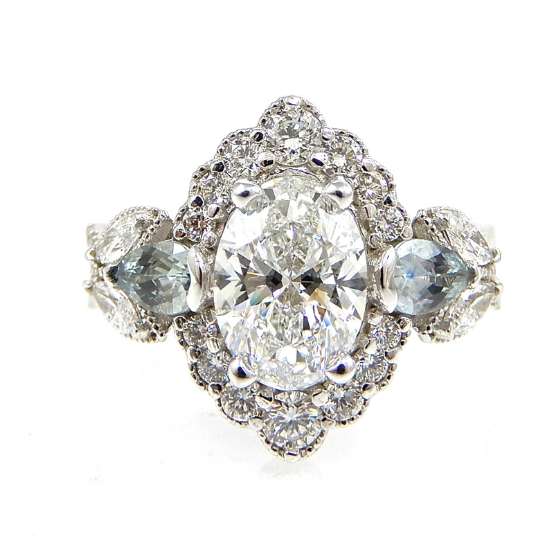 Oval Cut Diamond with Scalloped Halo and Accented Twisted Band