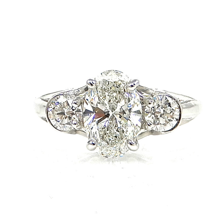 Oval Diamond with Round Side Stones Engagement Ring