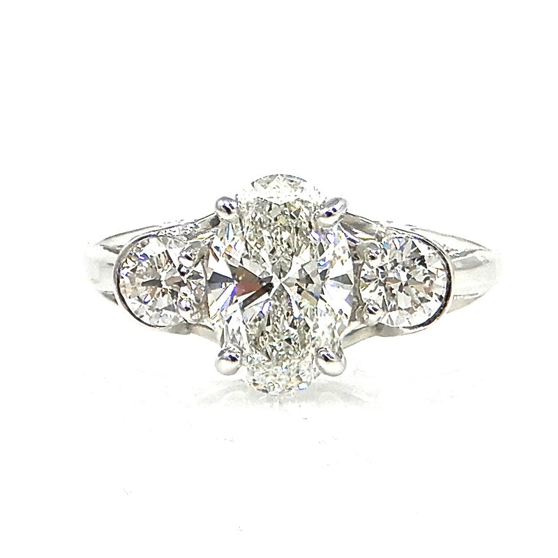 Oval Diamond with Round Side Stones Engagement Ring