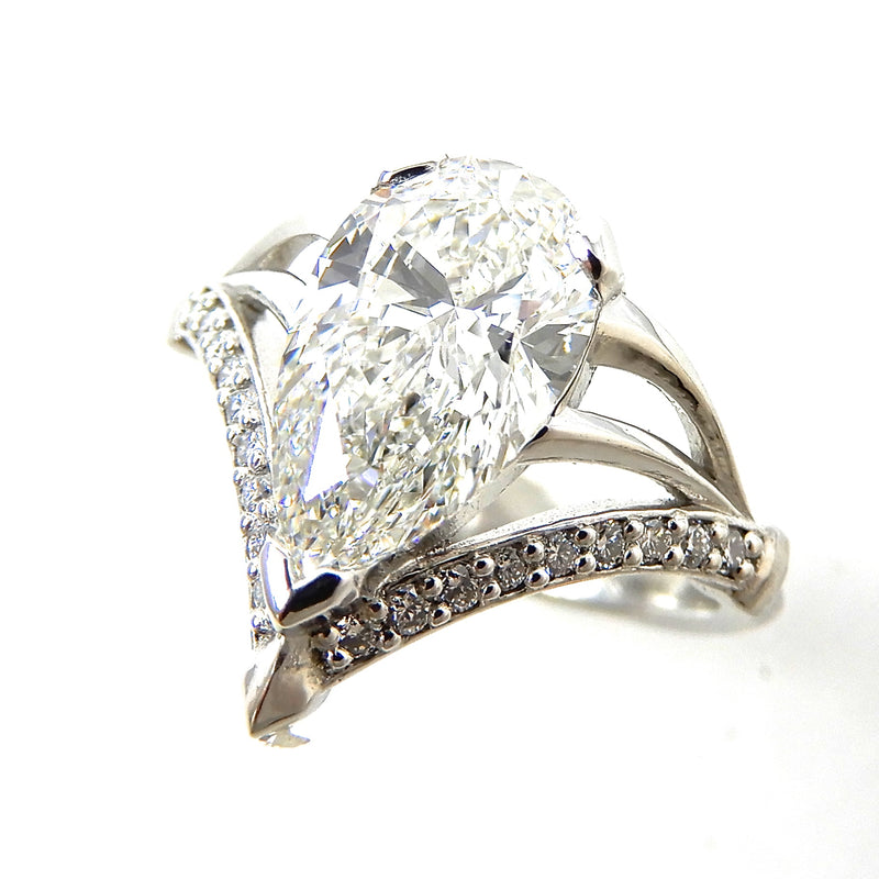 Pear Shaped Solitaire Engagement Ring with Diamond Accents