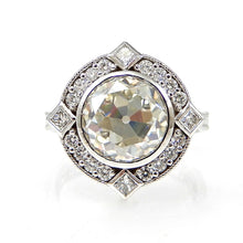 Load image into Gallery viewer, Round Bezel Set Diamond with Round and Princess Cut Halo Engagement Ring