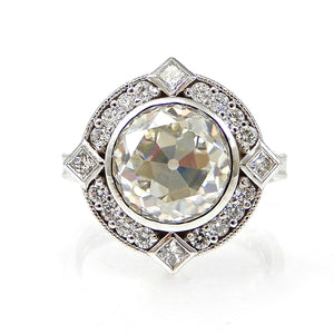 Round Bezel Set Diamond with Round and Princess Cut Halo Engagement Ring