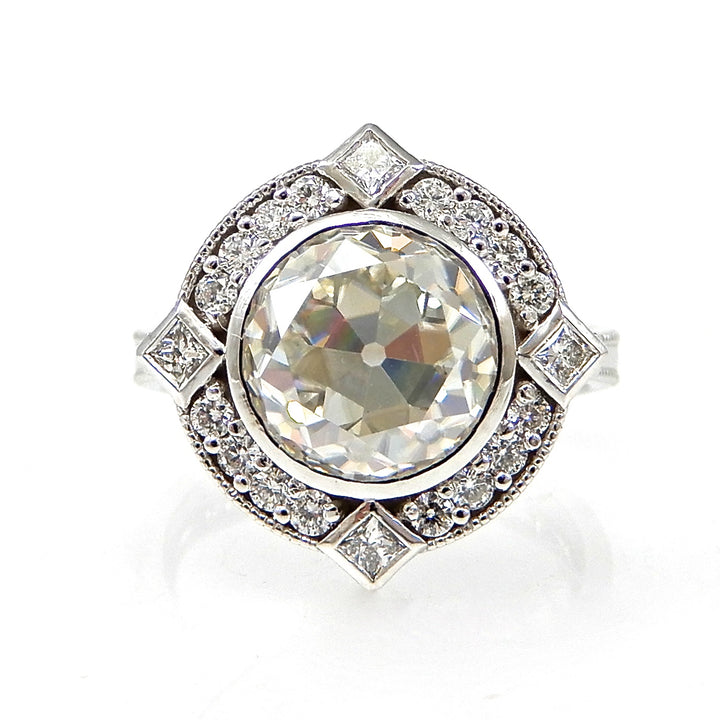 Round Bezel Set Diamond with Round and Princess Cut Halo Engagement Ring