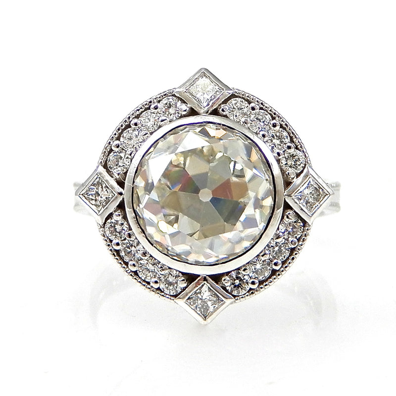 Round Bezel Set Diamond with Round and Princess Cut Halo Engagement Ring