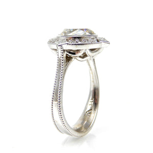 Round Bezel Set Diamond with Round and Princess Cut Halo Engagement Ring Side View