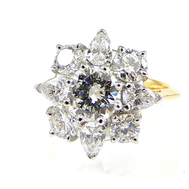 Round Cut Center Stone with Starburst Halo Engagement Ring