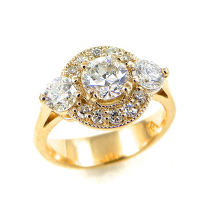Round Cut Diamond Three Stone Engagement Ring with Halo