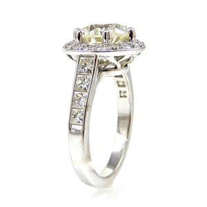 Round Cut Diamond with Diamond Halo and Princess Cut Accent Engagement Ring