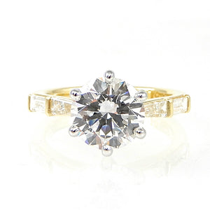 Round Diamond Solitaire Engagement Ring with Baguette Accents