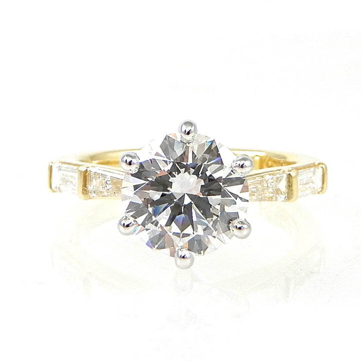 Round Diamond Solitaire Engagement Ring with Baguette Accents