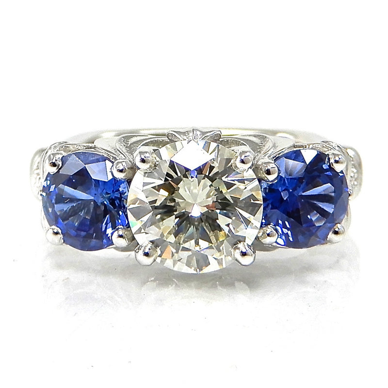 Round Diamond and Sapphire Three Stone Engagement Ring