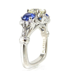 Round Diamond and Sapphire Three Stone Engagement Ring