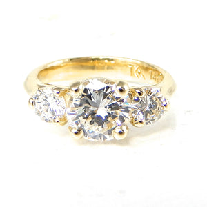 Round Three Stone Engagement Ring