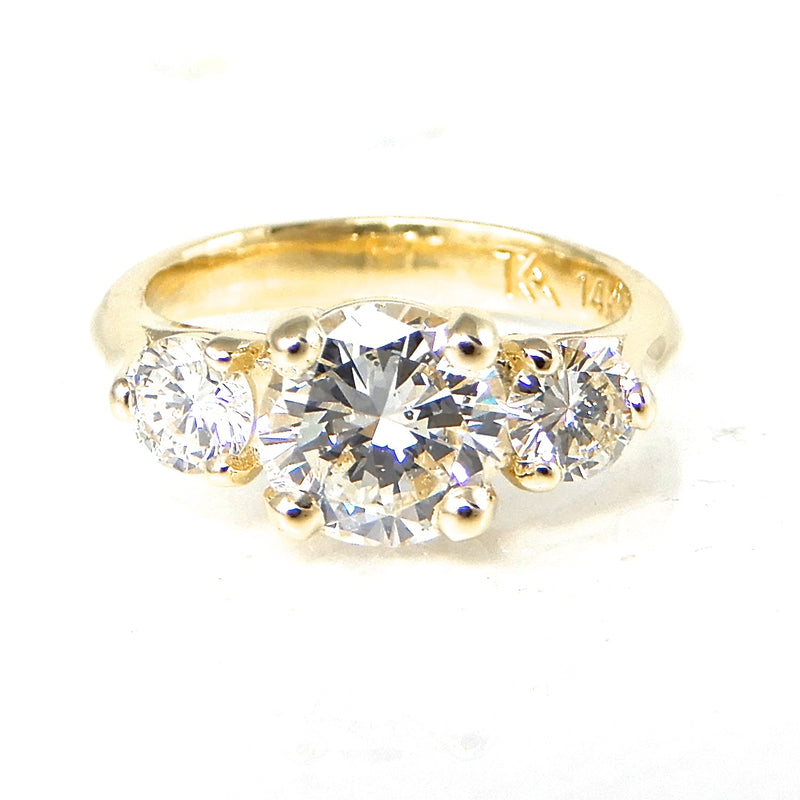 Round Three Stone Engagement Ring