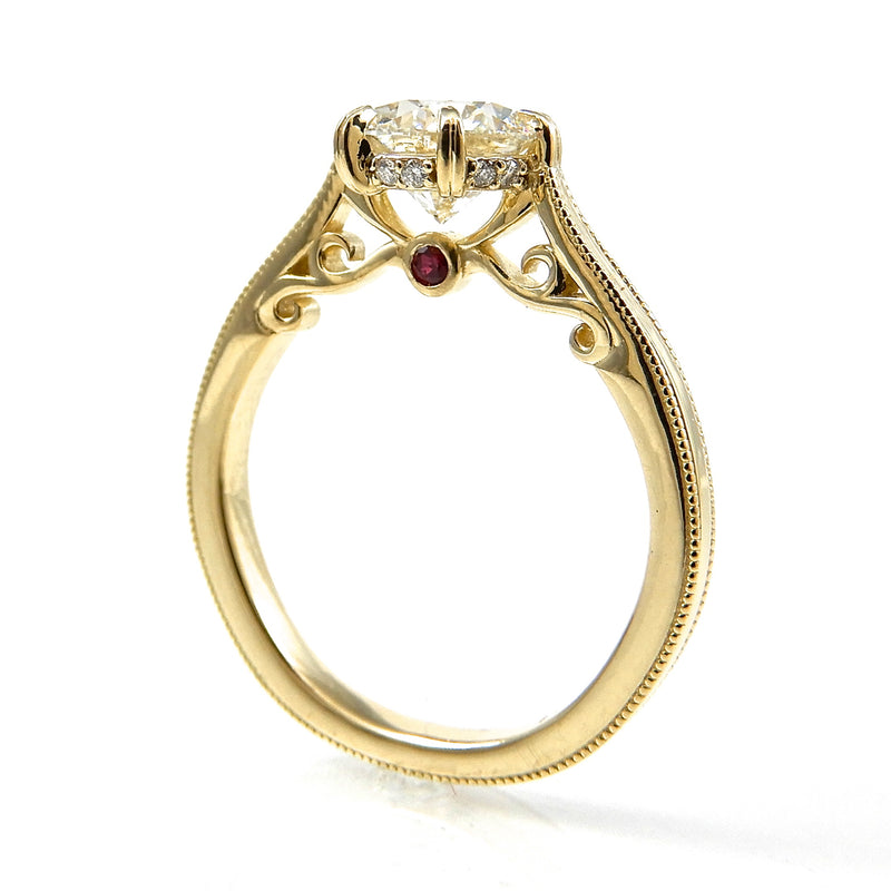 Solitaire Diamond Engagement ring with hidden halo and ruby detail with a milgrain detail on band