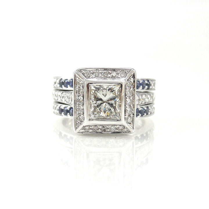 bezel-set princess cut diamond engagement ring with sapphire accents