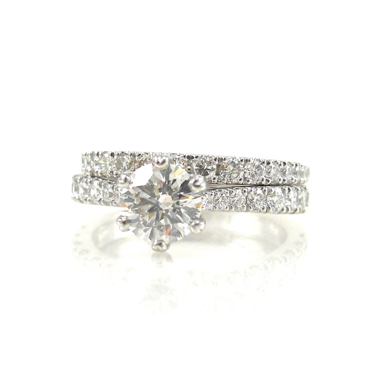 diamond solitaire engagement ring with diamond accents and matching diamond wedding band