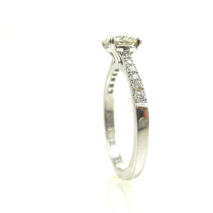 custom solitaire engagement with 4 prong set diamond center stone accented with diamonds in platinum or white gold