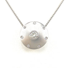 Load image into Gallery viewer, bezel-set round brilliant cut diamond center stone with diamond accents in satin finished white-gold necklace