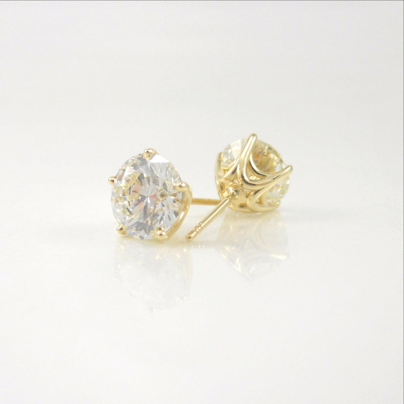 4.02ct diamond studs featured in custom-designed 14k yellow-gold baskets
