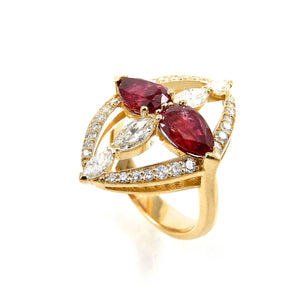 pear cut rubies and marquise diamonds with a round brilliant cut diamond accented frame