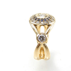 Custom Bezel set diamond engagement ring with double halo of sapphires and round brilliant diamonds