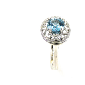 scrollwork, milgrain, and diamond accented mounting aquamarine center stone ring