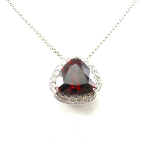handcrafted Rhodolite garnet pendant in a diamond accented mounting