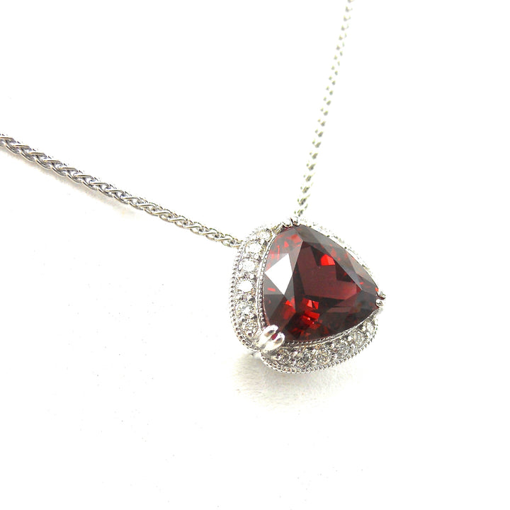 Rhodolite garnet pendant in a diamond accented mounting