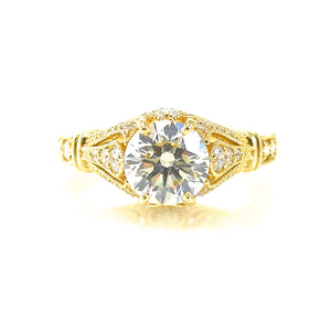 antique style solitaire engagement ring featuring filigree and diamond accents
