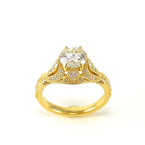 18k yellow gold antique style solitaire engagement ring featuring filigree and diamond accents
