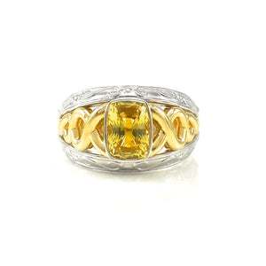 bezel-set yellow sapphire ring with yellow and white-gold decorative setting