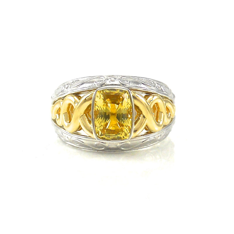 bezel-set yellow sapphire ring with yellow and white-gold decorative setting