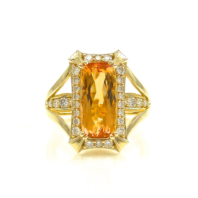 Imperial Topaz center stone with round brilliant cut diamond accent ring