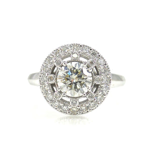 halo engagement ring with a star burst arrangement of diamonds surrounding the center stone
