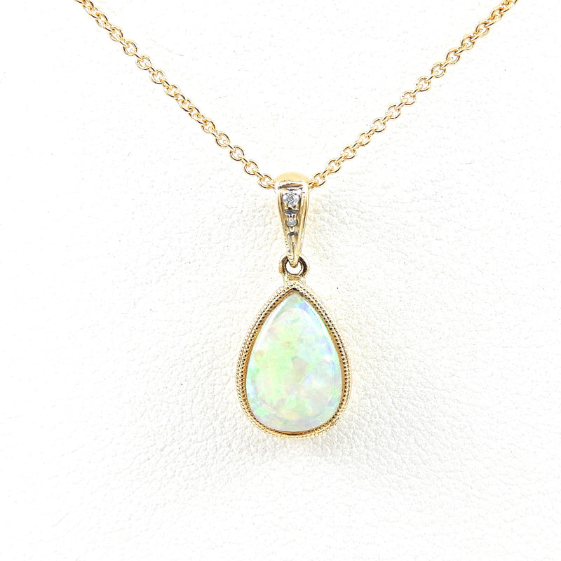 Pear Shape Opal Pendant with miligrain bezel and a diamond accented bail