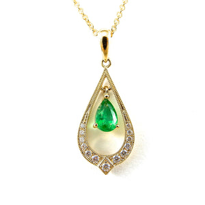 Pear shaped emerald drop pendant with tear drop diamond halo in yellow gold