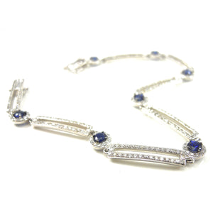 Sapphire with diamond halo and diamond bar bracelet